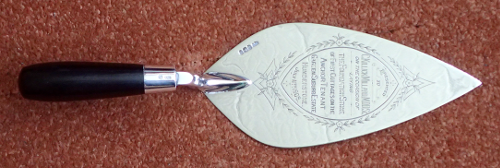 The silver trowel with ebony handle